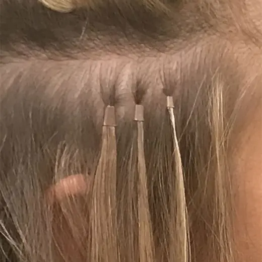 Three microbead extensions in a row, close to the scalp