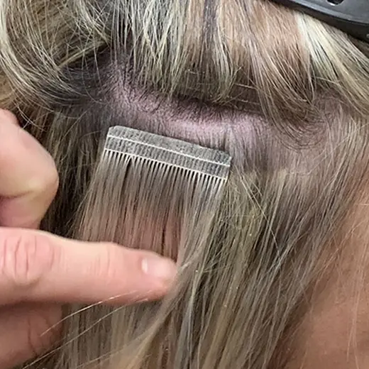 A finished tape-in tab lying flat on the head