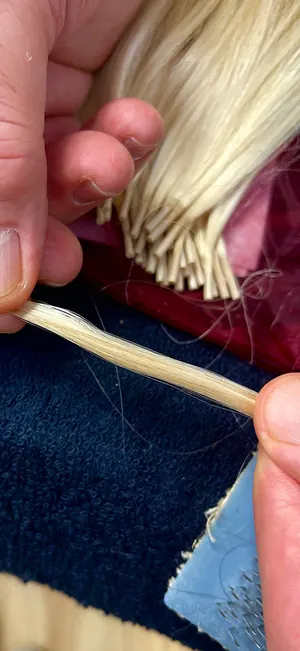 A custom-ordered I-tip strand blending two hair colors